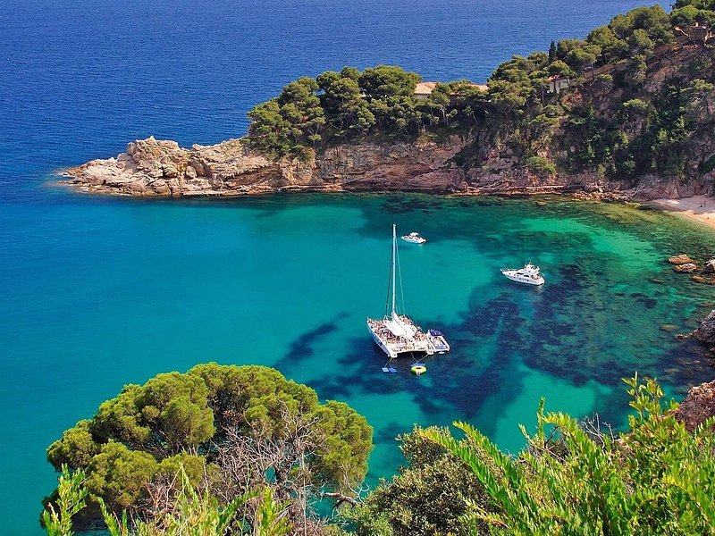 A sheltered cove on the Costa Brava with boats at anchor