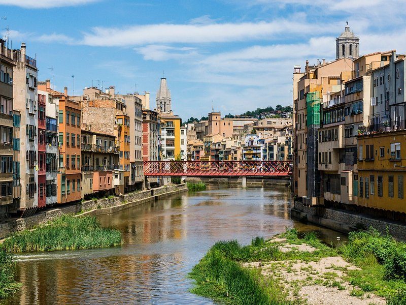 The painted houses of Girona standing over the river Onyar