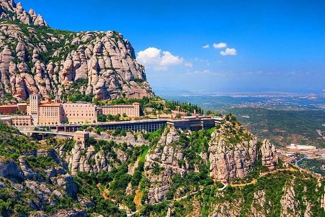 The monastery of Montserrat on its ledge, the Catalan plain beyond